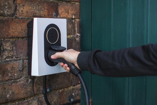 An electric vehicle charging point on a wall