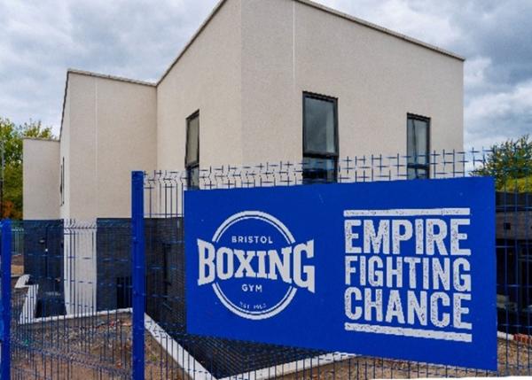 Empire Fighting Chance sign and new building