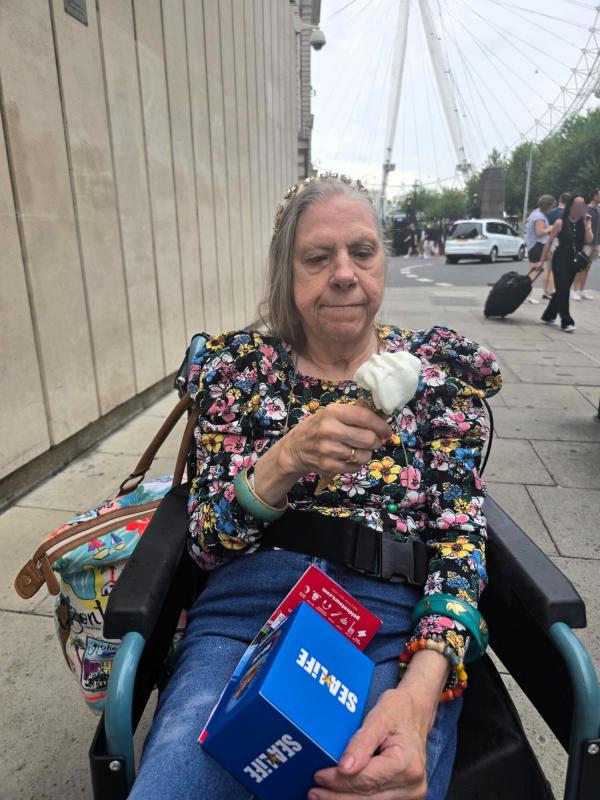 Linda enjoys an ice cream.