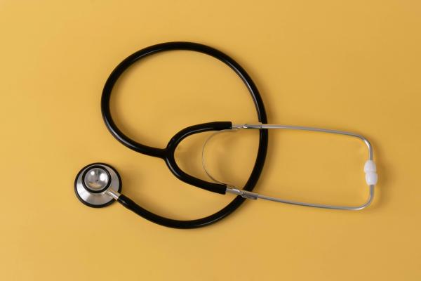 Stethoscope on a yellow background