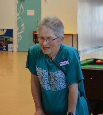 Volunteer Marjory stands talking at the Eastleigh Serendipity group