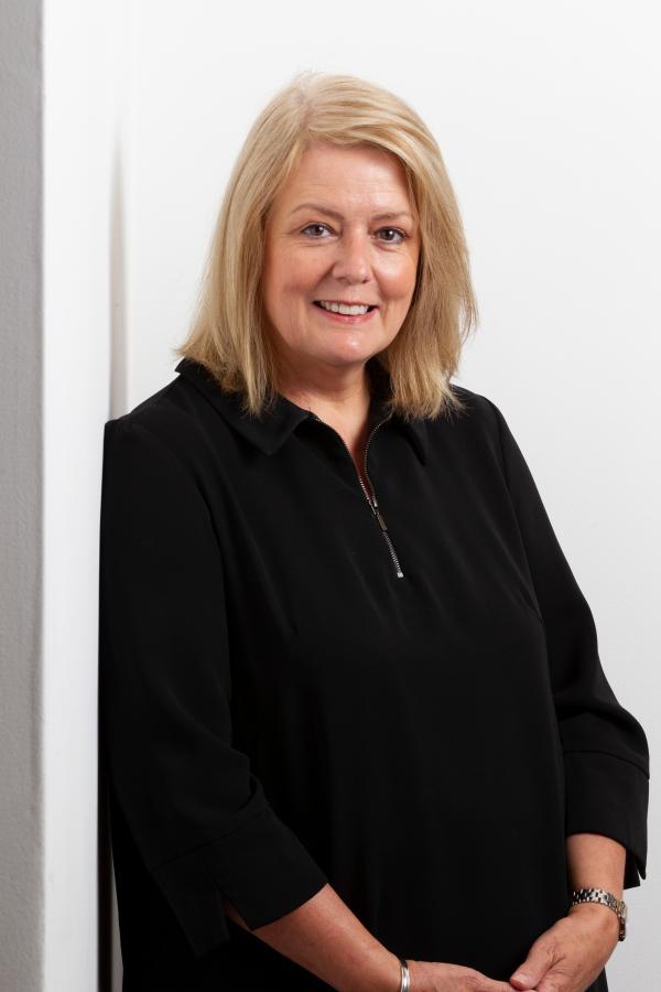 A profile photo of Jo Land dressed in black.