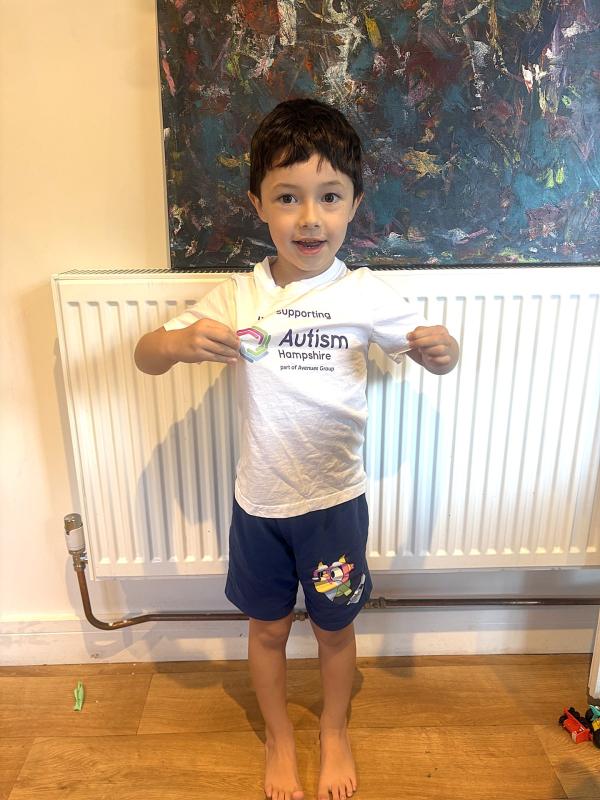 Keanu poses for the camera in his Autism Hampshire t-shirt.